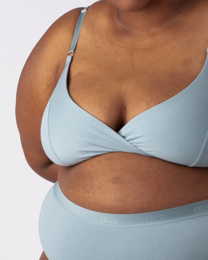 woman wearing an albertine organic cotton nisa bralette in blue