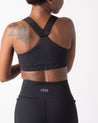 woman wearing nisa vanessa racerback sports bra in black
